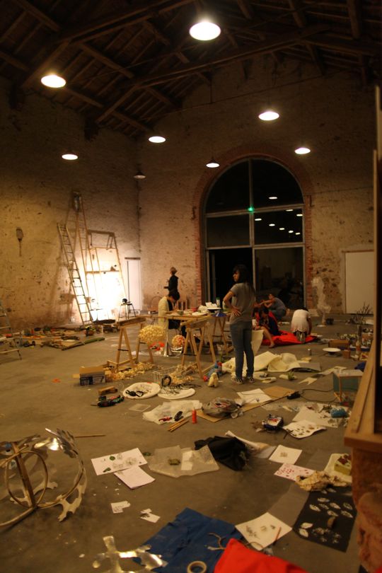'A quick pic of other designers slaving it out late into the night inside the hall/barn of Domaine de Boisbuchet. That is not mess. It is transformative assembly!'  – Tomas Kral Boisbuchet – Image Dean Homicki