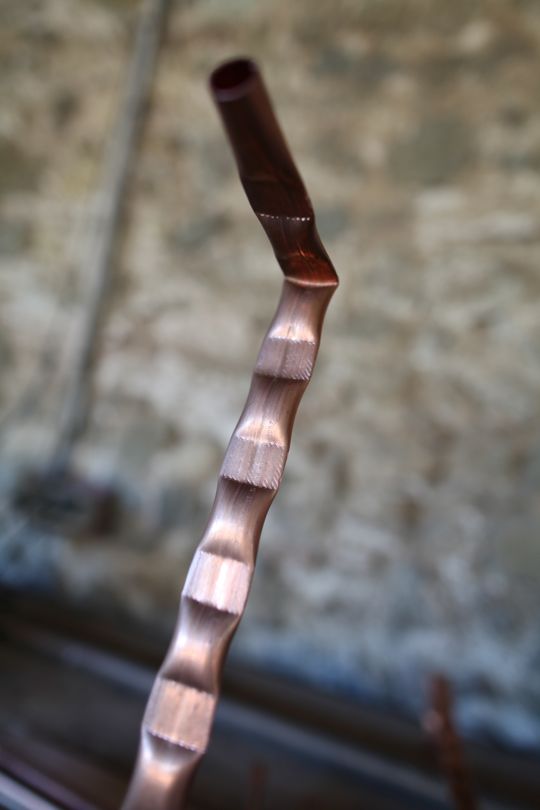 'A 90 degree bend is made one copper bubble up from each end. This will eventually be inserted and clamped by timber cross members' – Tomas Kral Boisbuchet – Image Dean Homicki